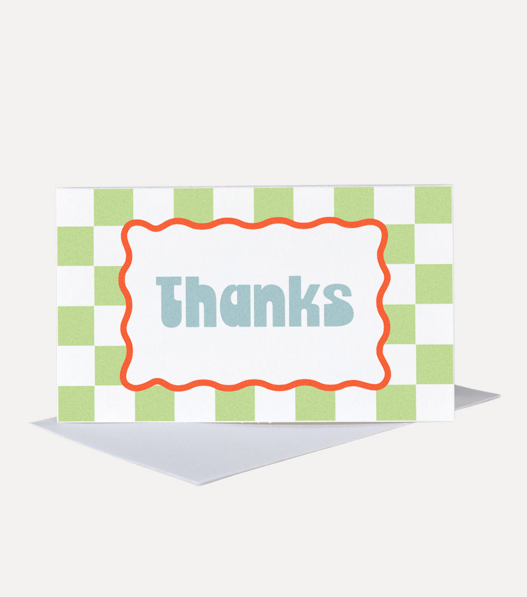 mini greeting card with greein and white checkerboard design and red wavy border with a message in the middle that says "thanks,"