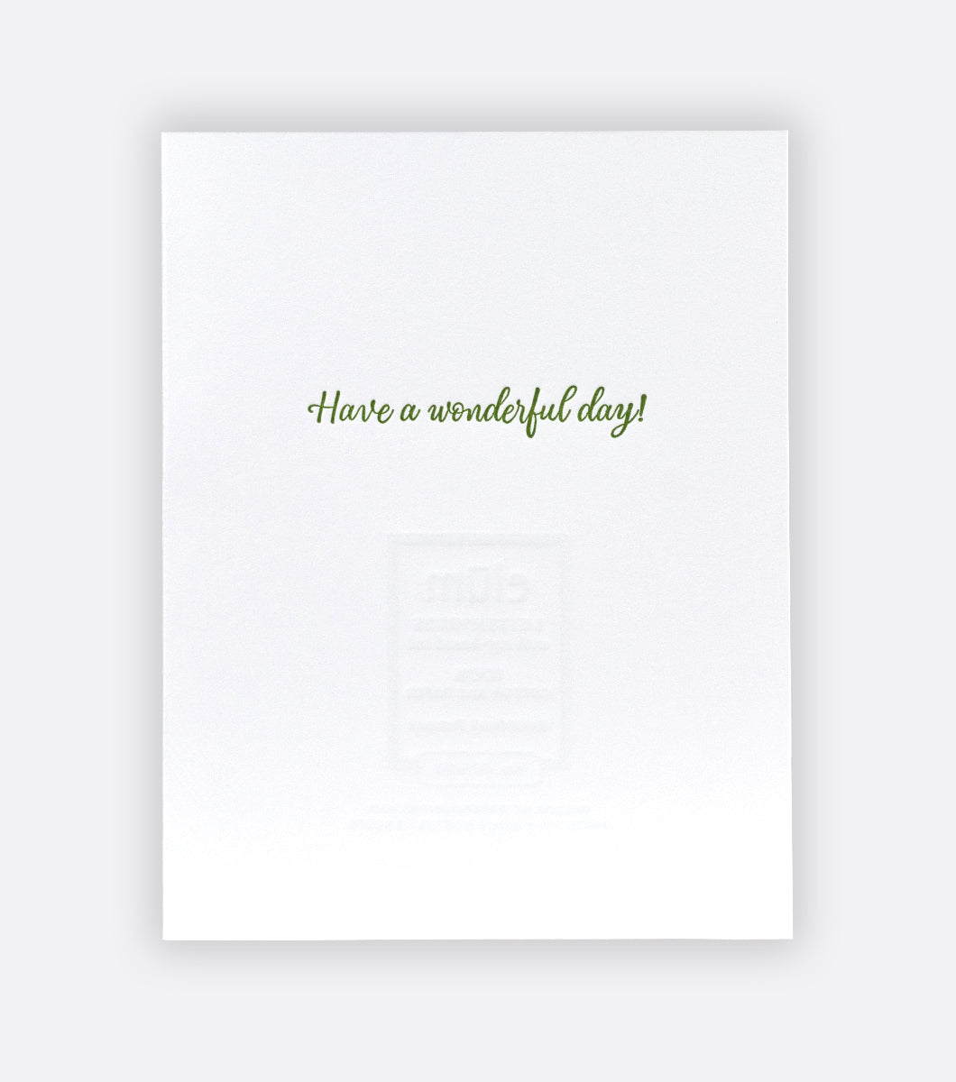 inside of sketchbook bouquet letterpress greeting card on a gray background with a message that says "have a wonderful day!"