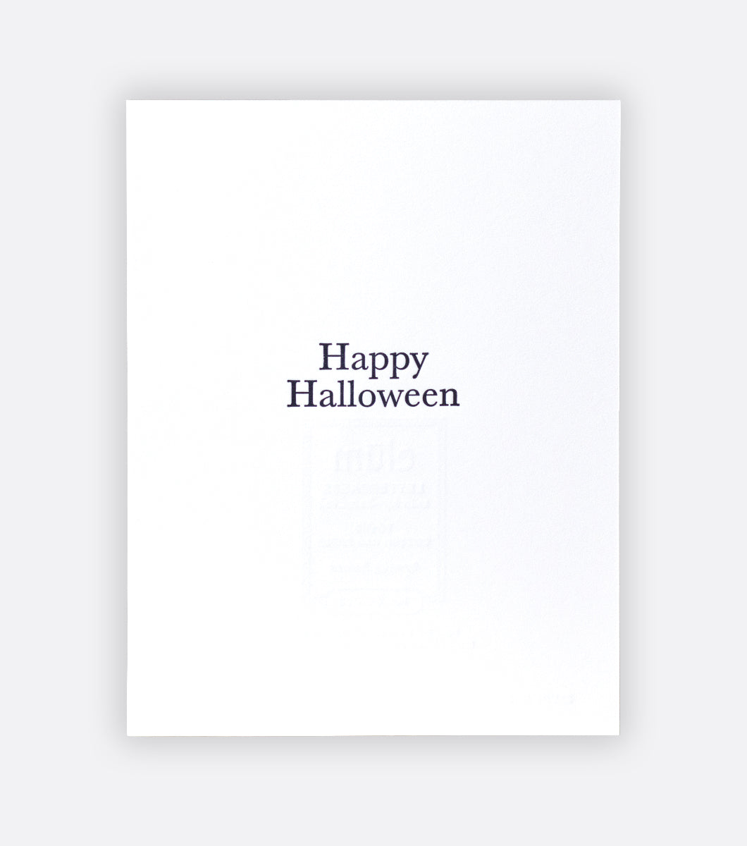 inside of spooky season letterpress greeting card that says "happy halloween"
