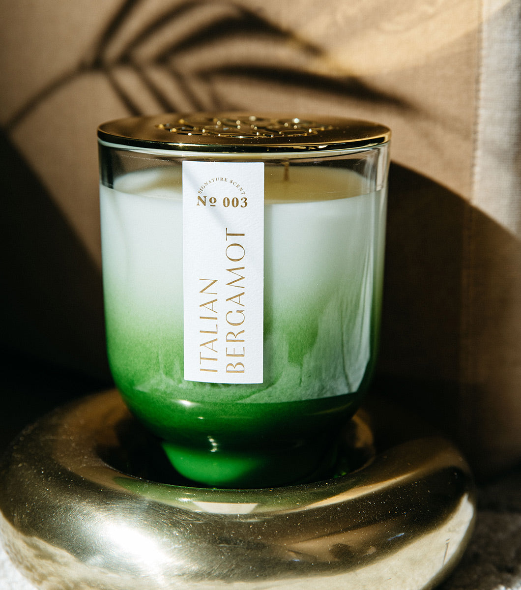 large green italiian bergamot scetned candle pictured in modern style living space