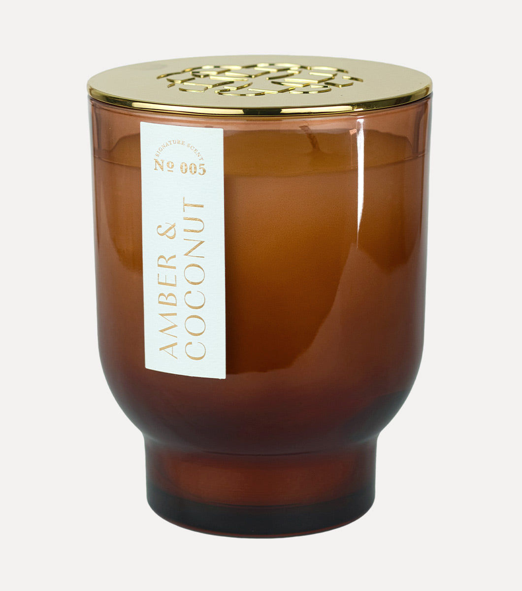 large brown amber and coconut hand poured soy wax candle with gold lid