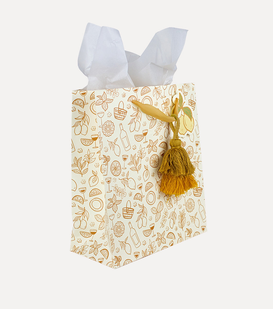 medium sized gift bag with drawings of picnic inspired icons with a tassel and 3 included sheets of white tissue paper