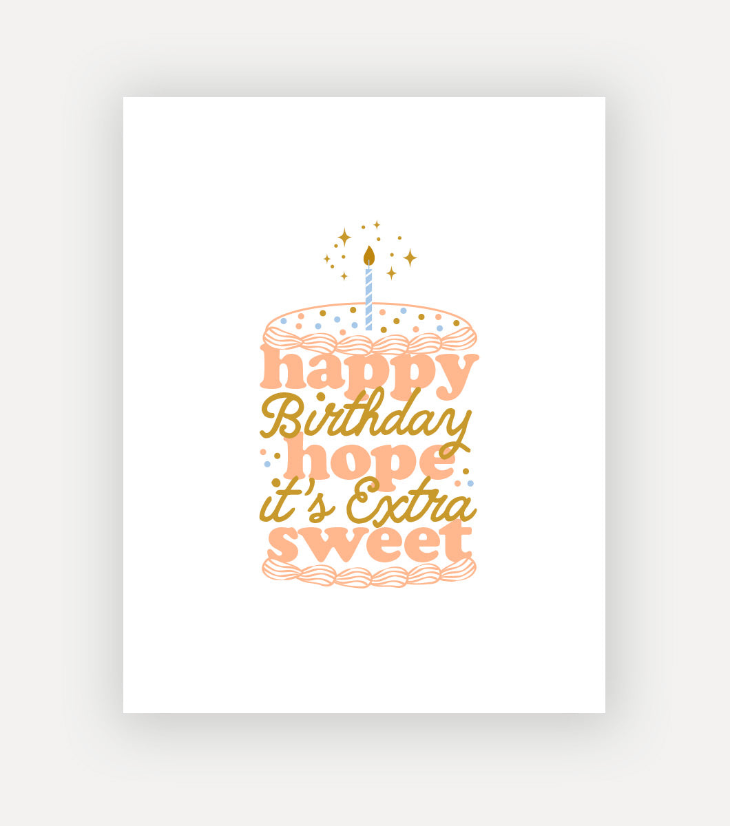 birthday greeting card that says "happy birthday hope it's extra sweet" across the front with gold foil accents. the message is written so that the words look like the different layers of the birthday cake