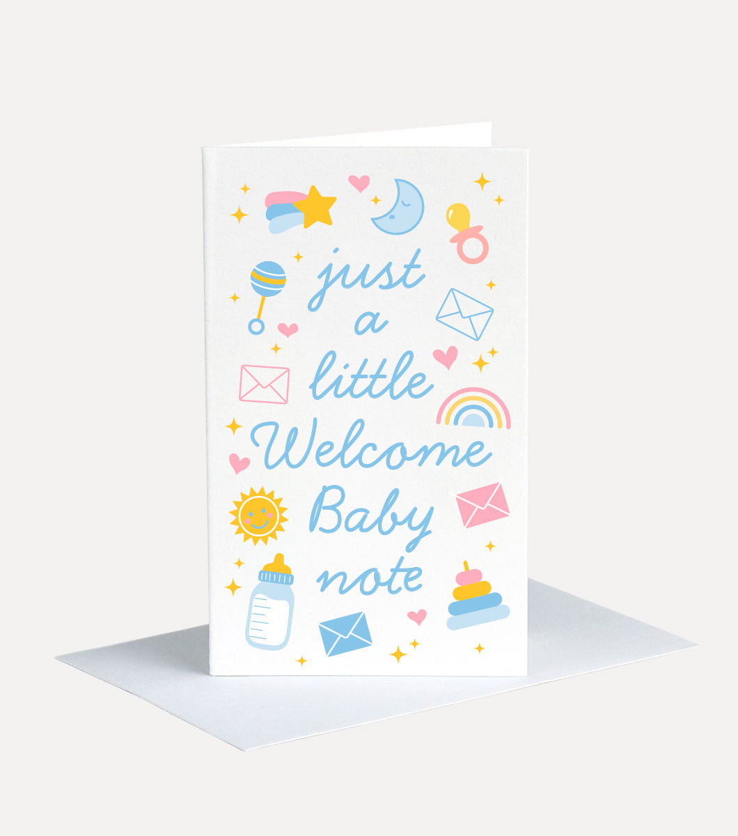 mini greeting card with message that says "just a litlte welcome baby note" with icons around it of baby items such as rattles, bottles, rainbows, suns and moons 