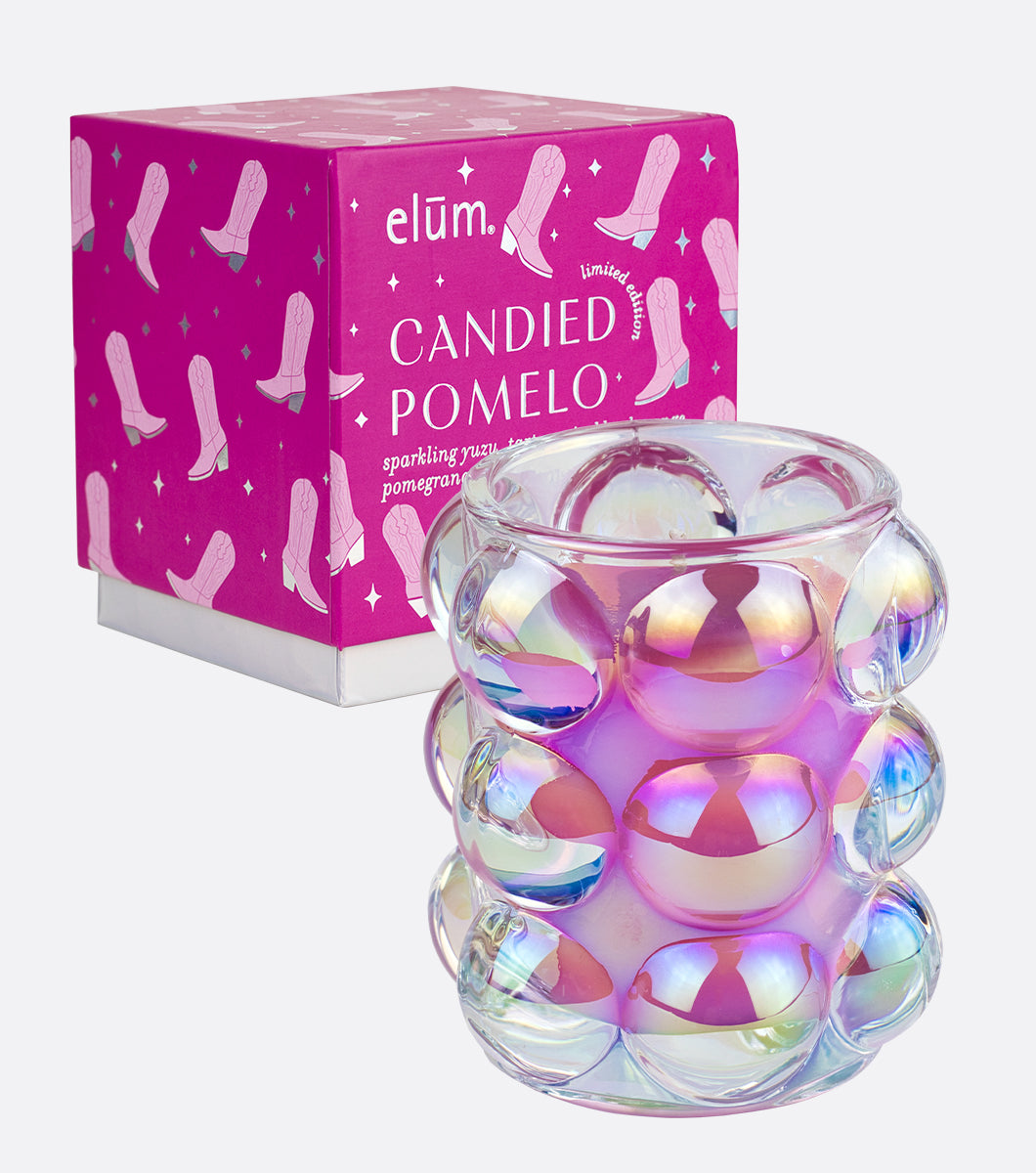 pink pony club disco cowgirl designed gift box with iridescent bubble glass candle next to it