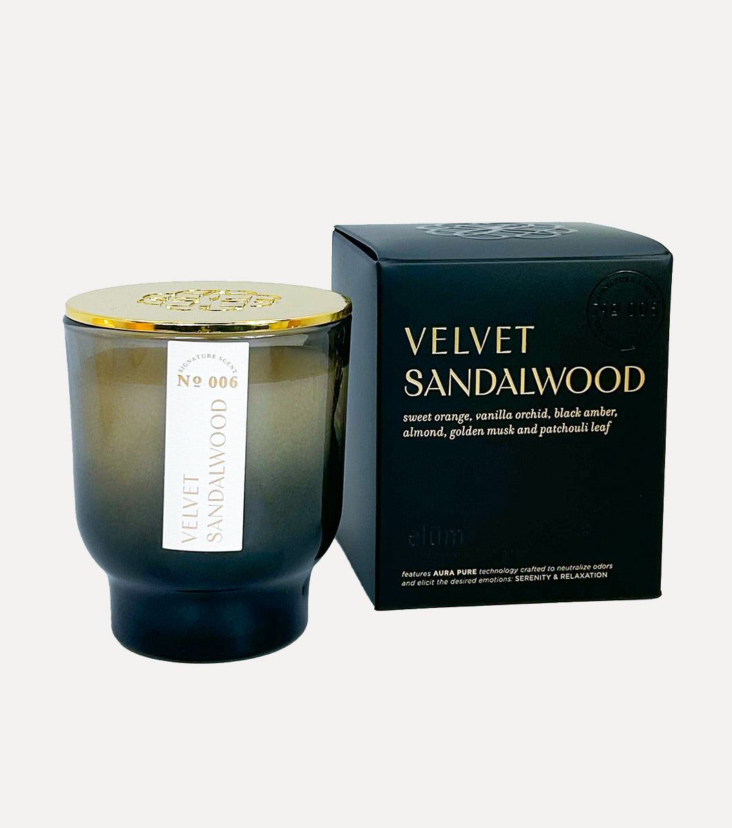 small black velvet sandalwood scented candle pictured next to included black gift box