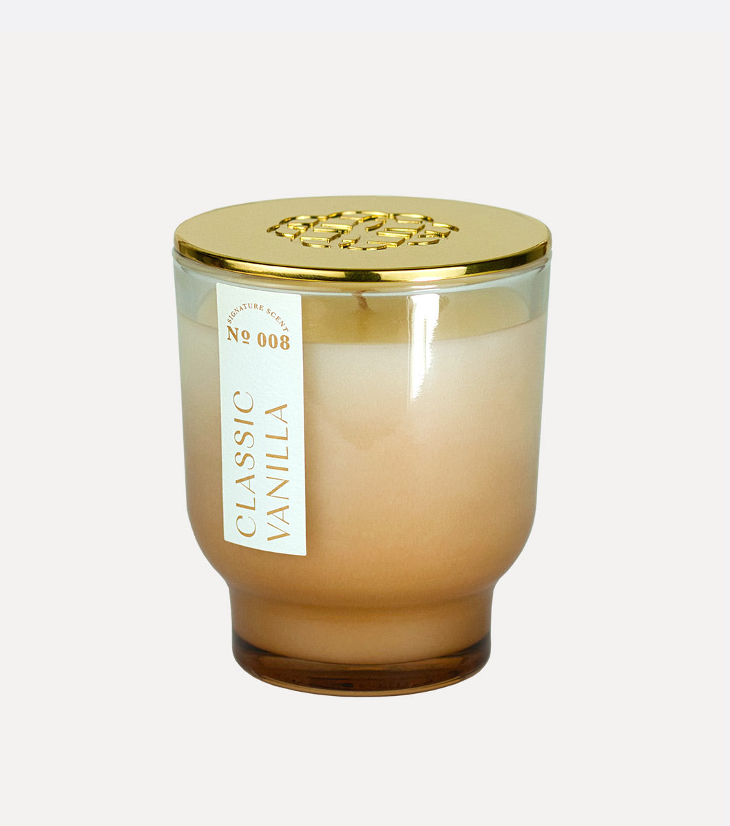 small tan classic vanilla scented hand poured candle with gold lid 