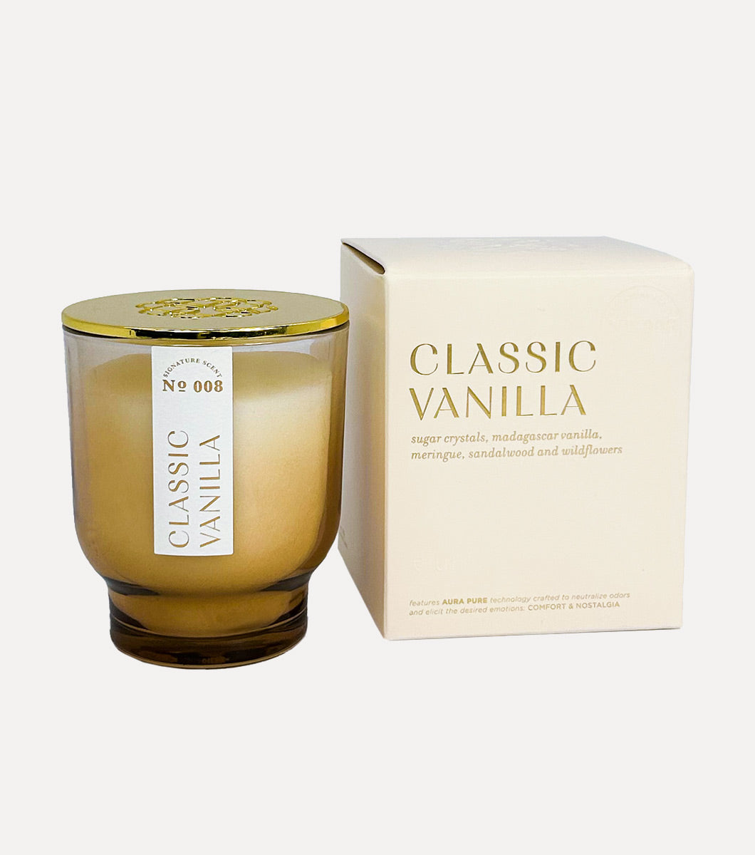 small classic vanilla scented candle pictured next to included cream colored gift box