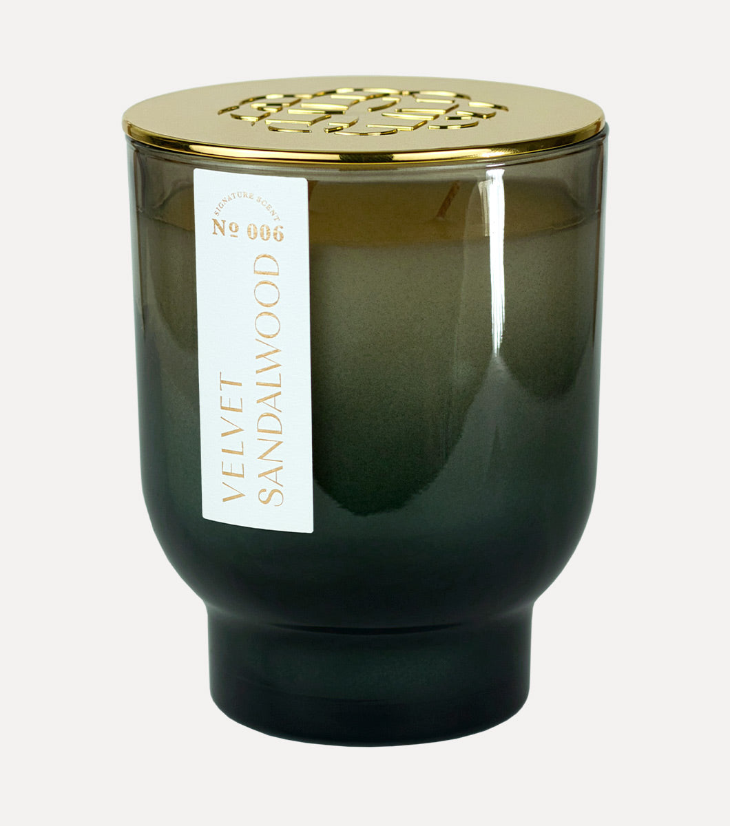 large tapered black velvet sandalwood scented hand poured soy wax candle with embosesed gold lid