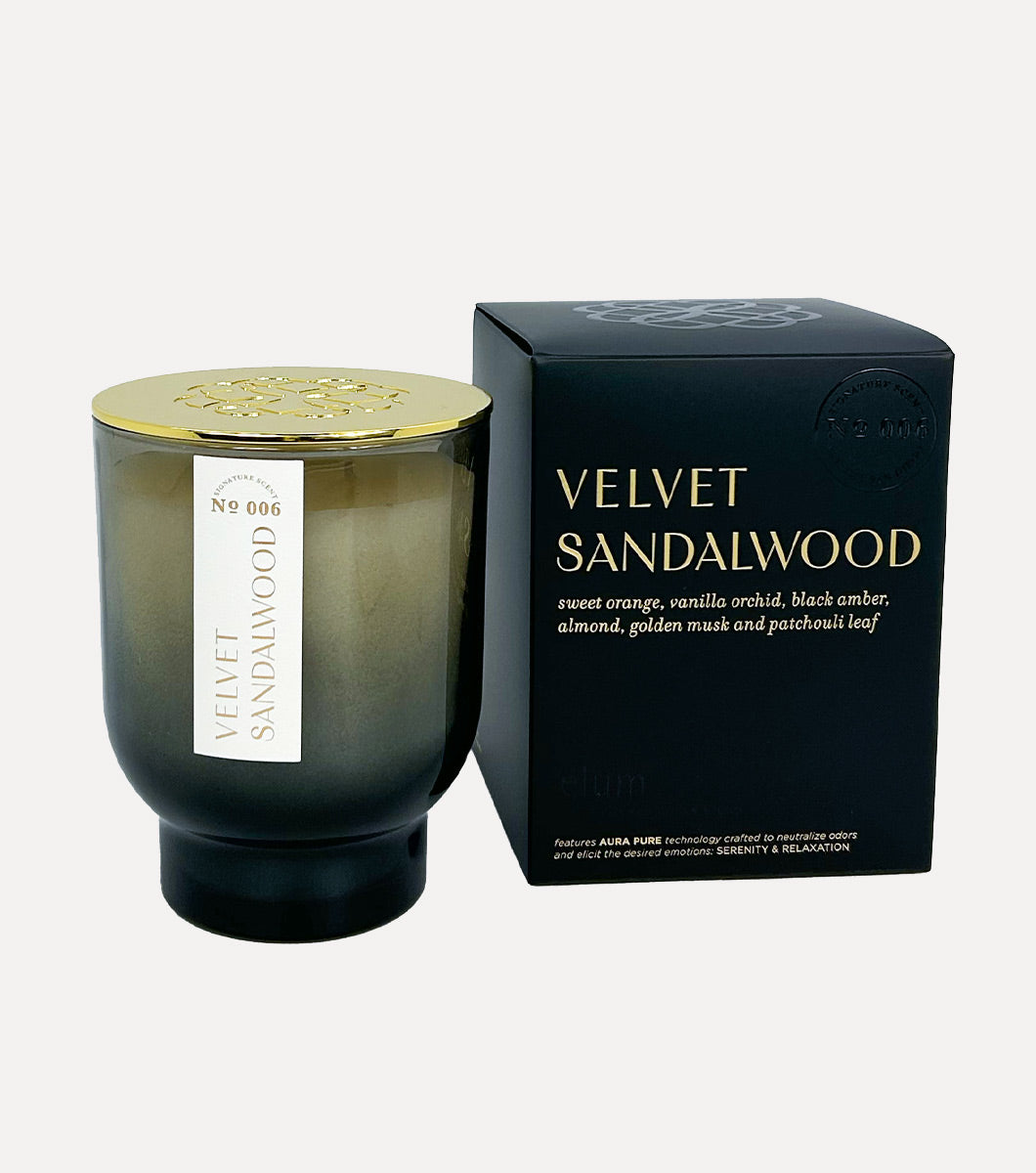 large black velvet sandalwood candle pictured next to included gift box