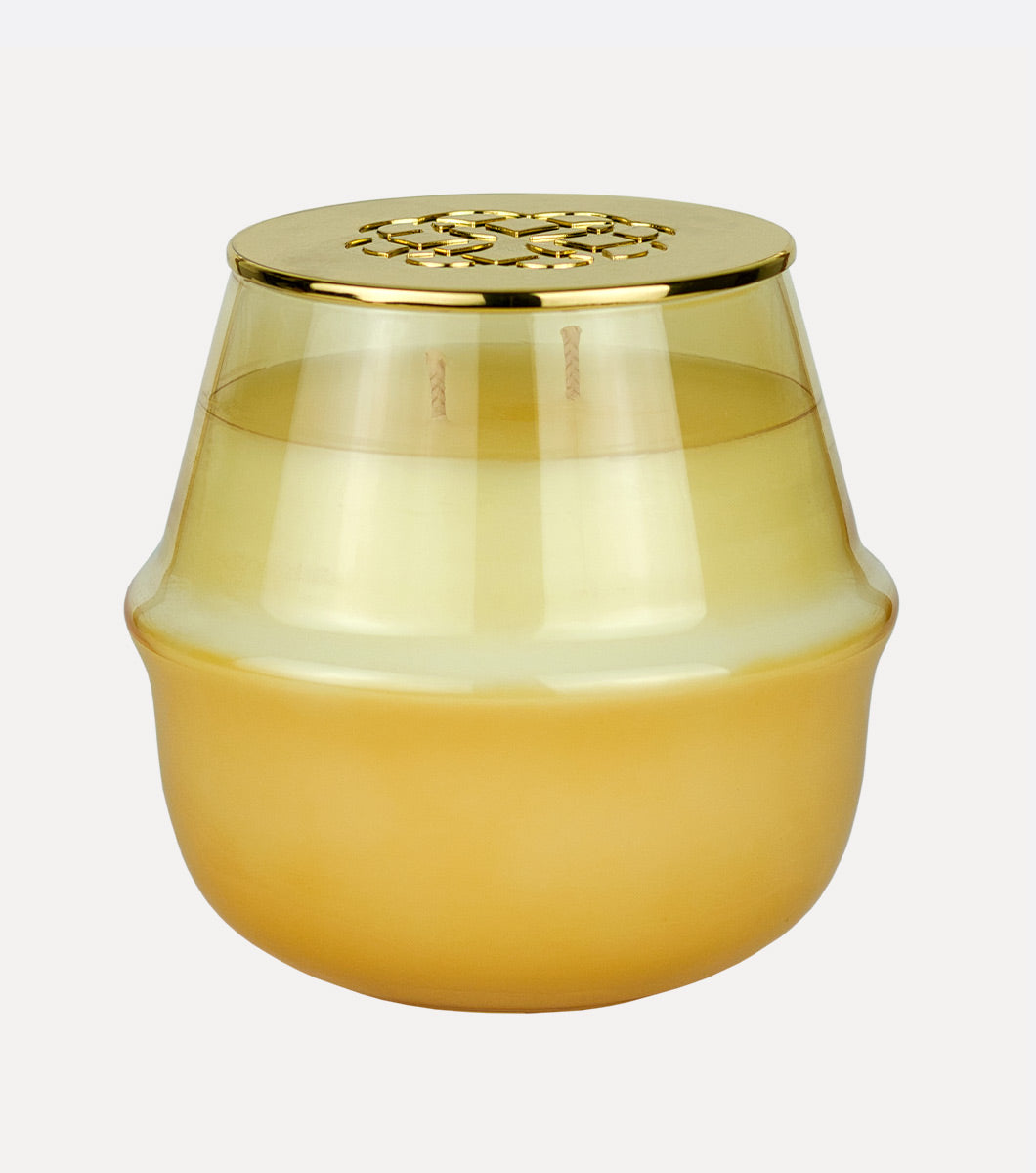 large round yellow golden basil and mint scented hand poured soy wax candle with embossed gold lid