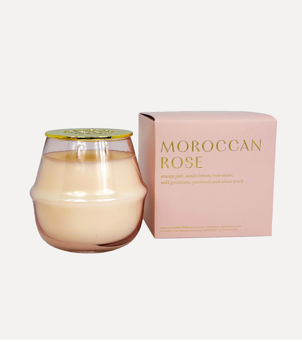 round pink moroccan rose scented candle pictured next to included gift box