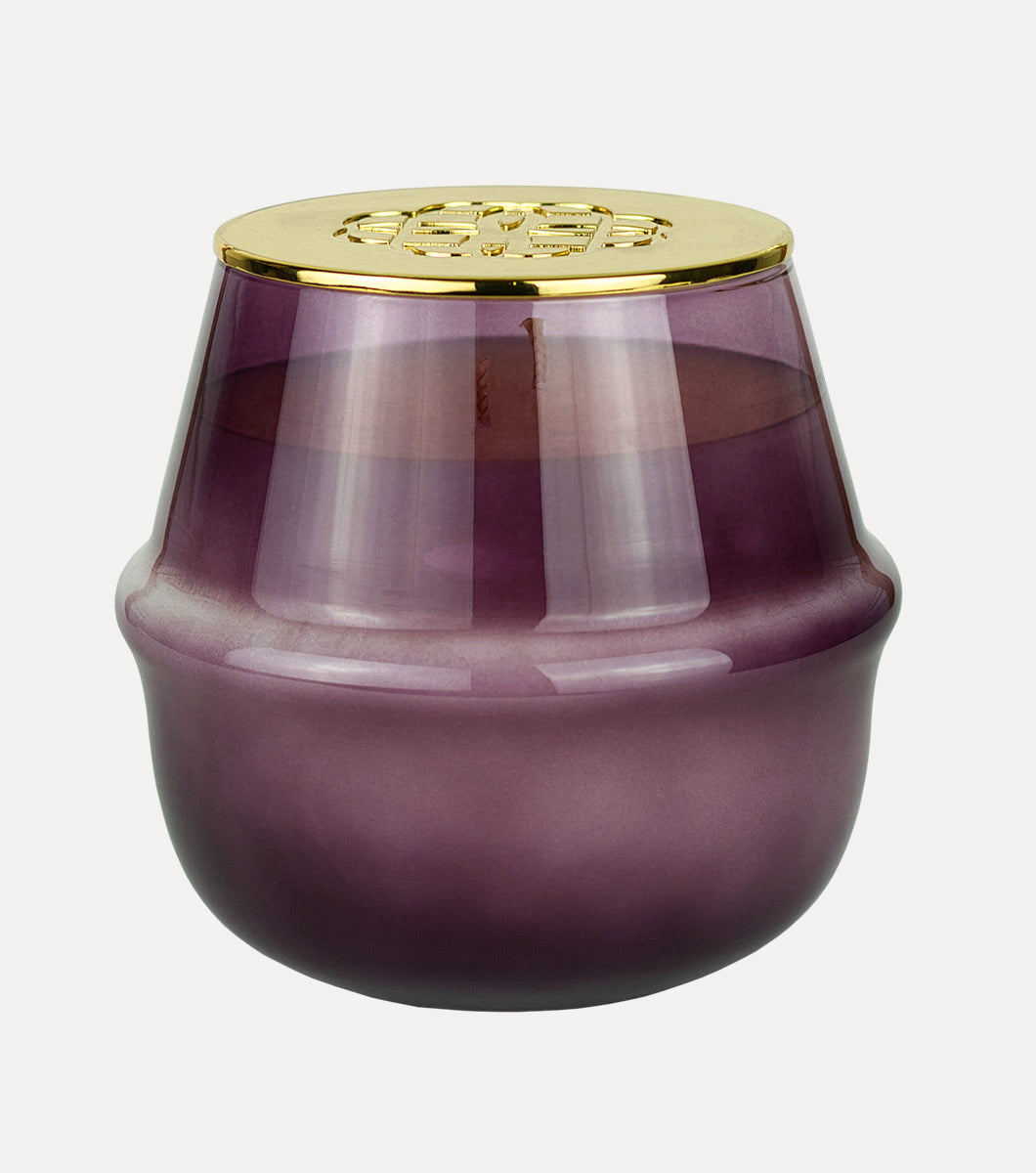 large round purple currant and oakmoss scented hand poured soy wax candle with embossed gold lid