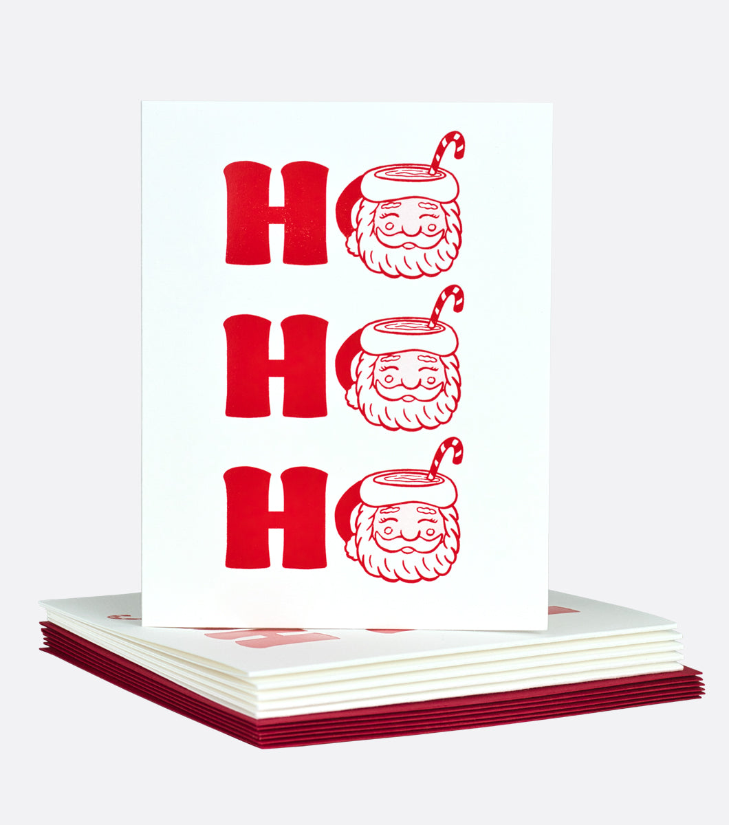 Letterpress holiday greeting card with design that says HO HO HO, with the O's as santa mugs with candy canes