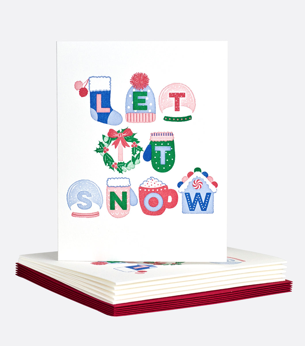 Holiday greeting card that features icons of holiday objects such as mittons, hats, snow globes, wreaths, mugs and gingerbread houses, inside each icon is a letter that spells out "let it snow" 