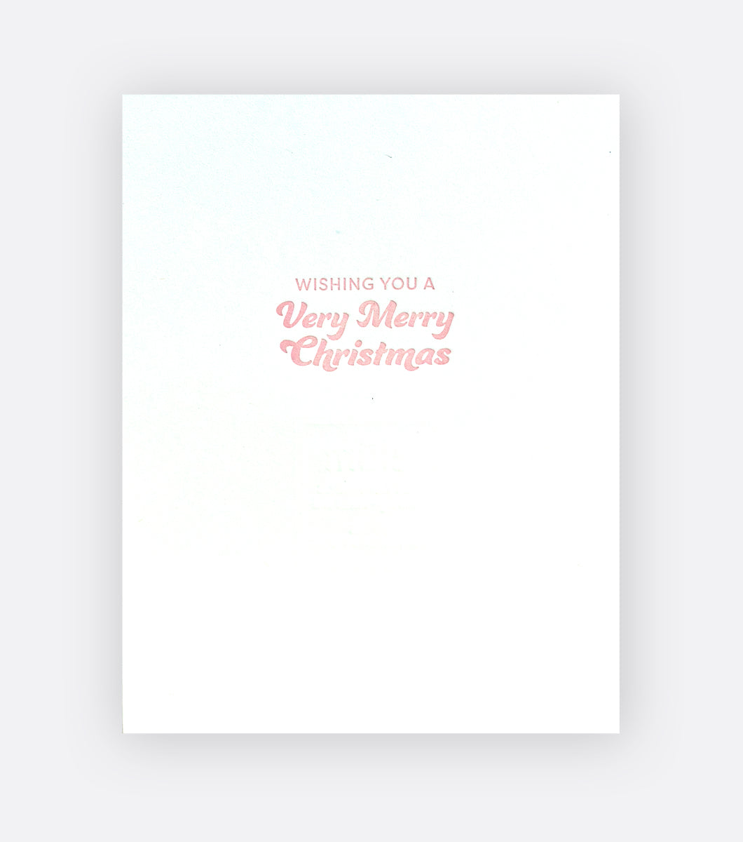 Inside of holiday greeting card that says "wishing you a very merry christmas" 