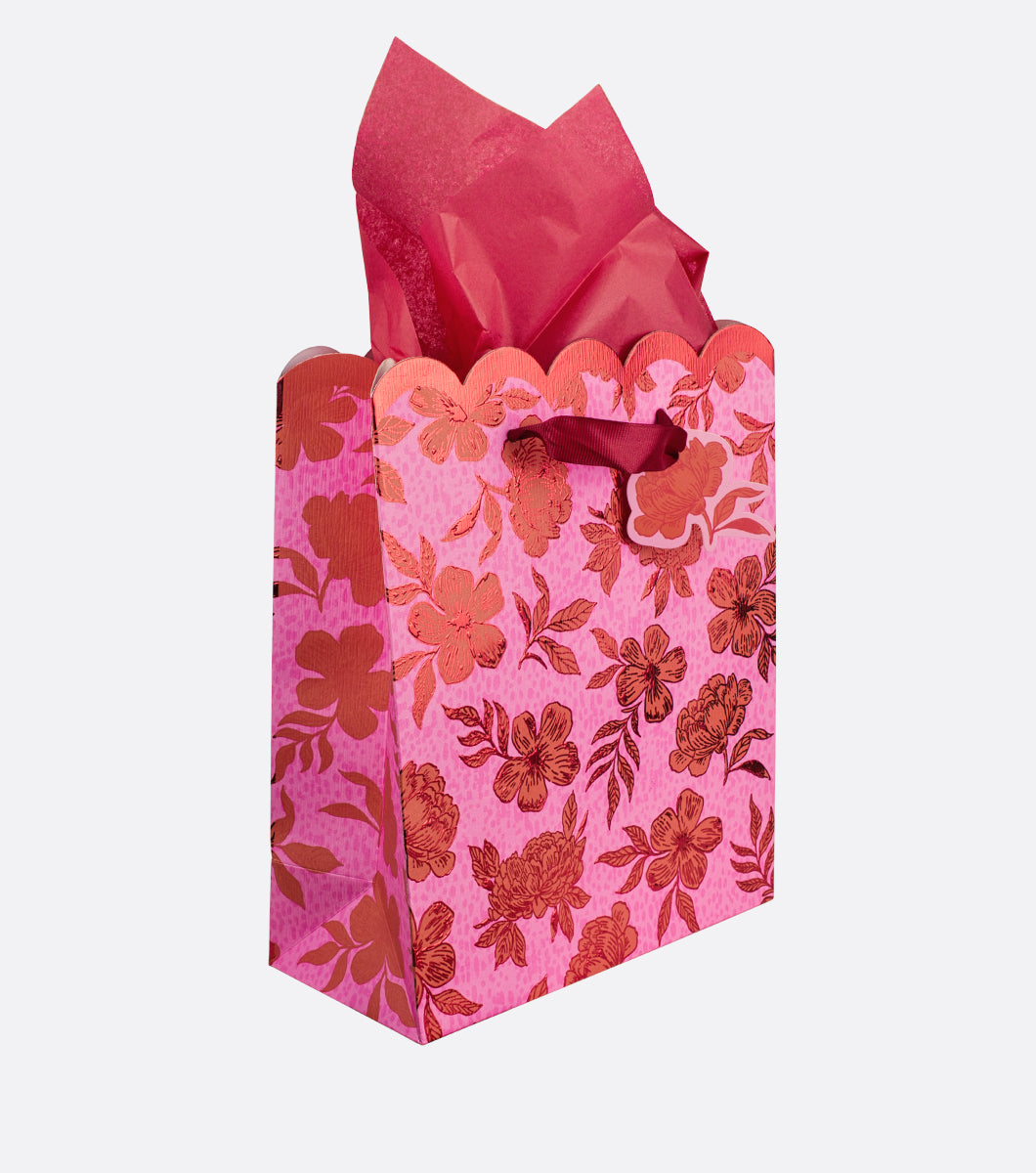 medium gift bag with red and pink floral design  and red tissue paper