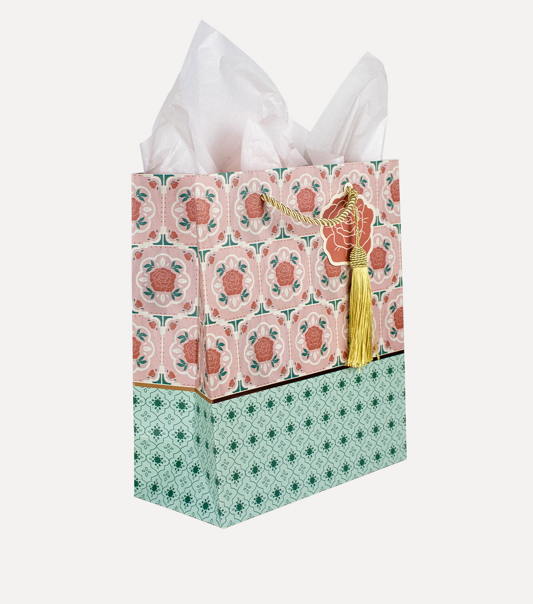 Medium gift bag wiht moroccan tile design in pink and teals with blush colored tissue paper