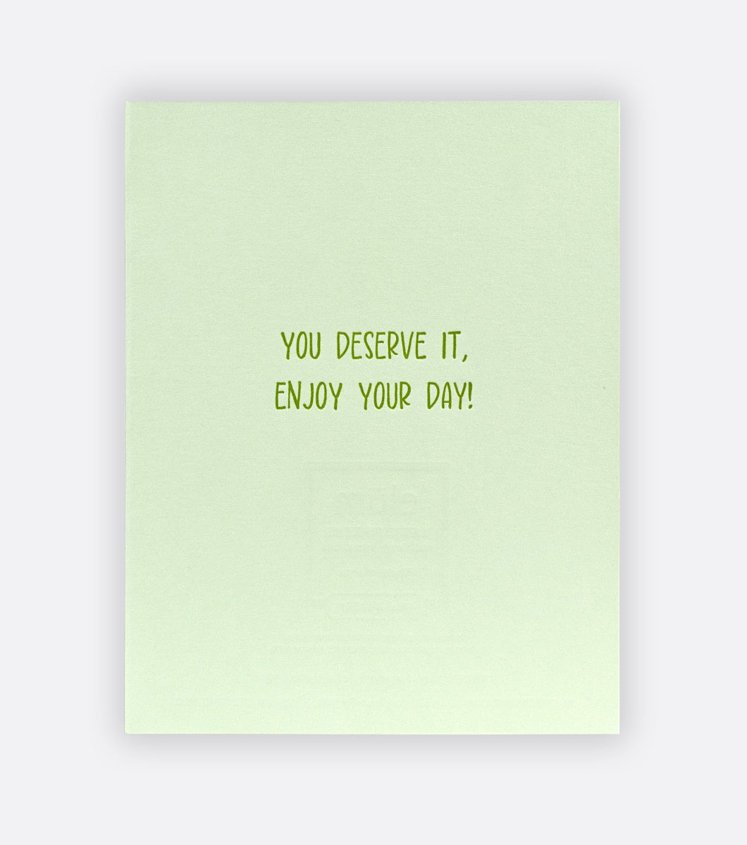 Inside of Finest Margs letterpress greeting card on a light gray background with a message that says "you deserve it, enjoy your day!" 