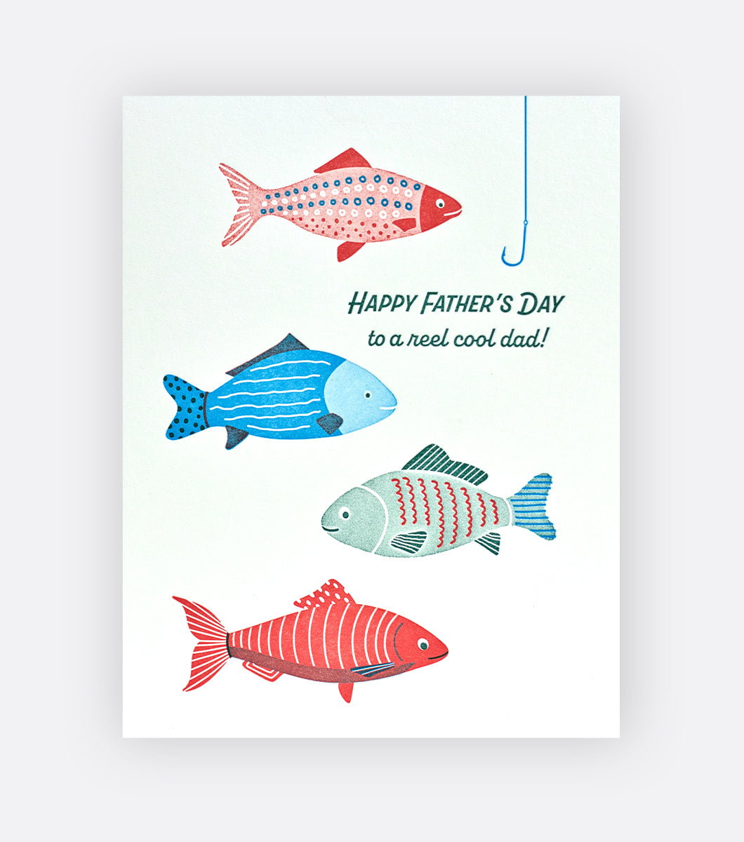 father's day greeting card that features a fishing line and hook and red and blue fish with a message that says "happy father's day to a reel cool dad!" 