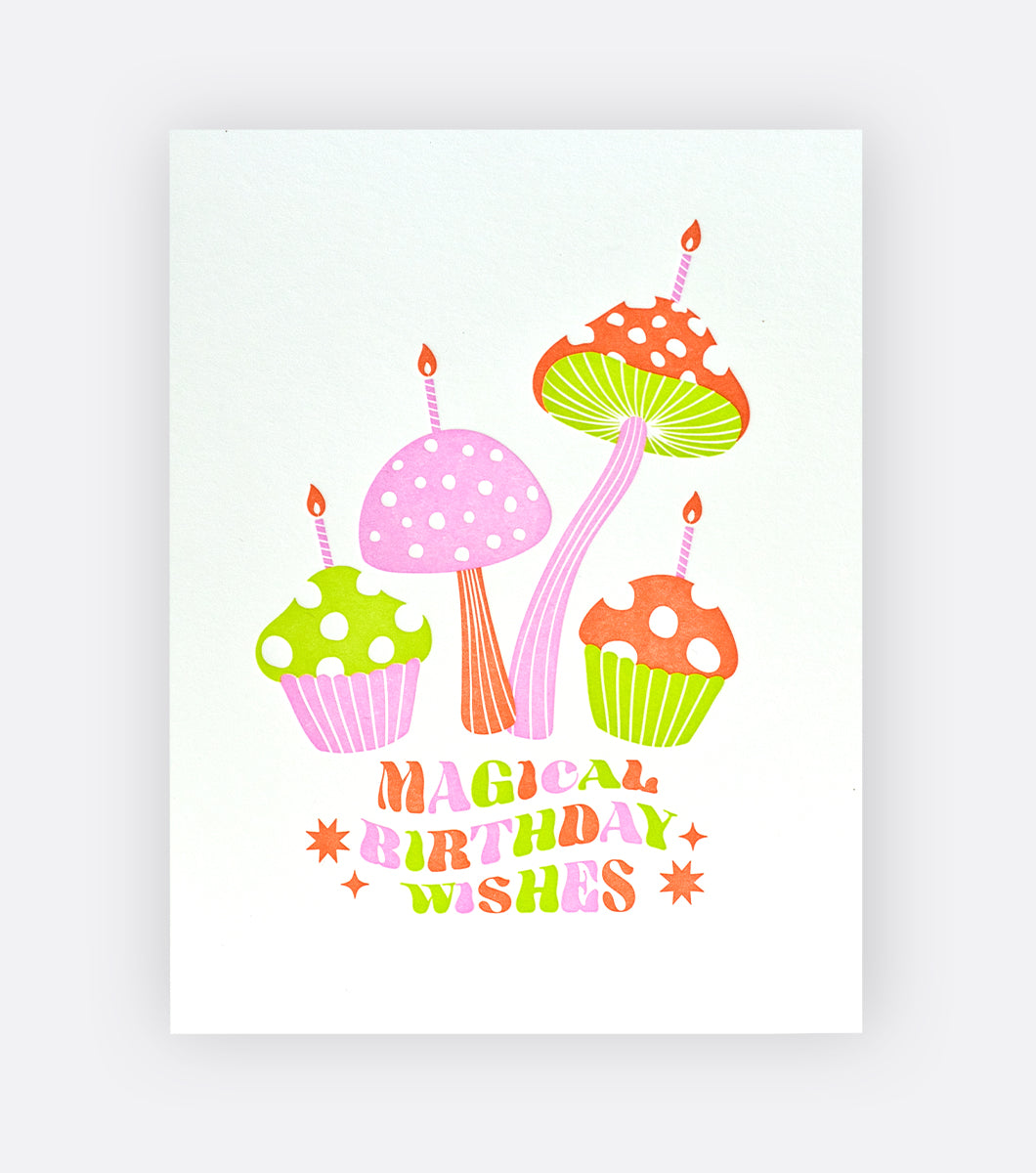 happy birthday greeting card with cupcake and mushroom design with a message that says "magical birthday wishes" in a retro font 