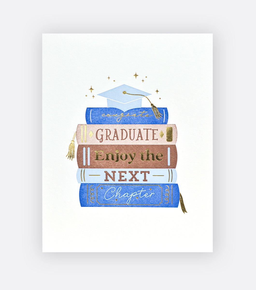 greeting card featuring stack of books with a graduation cap