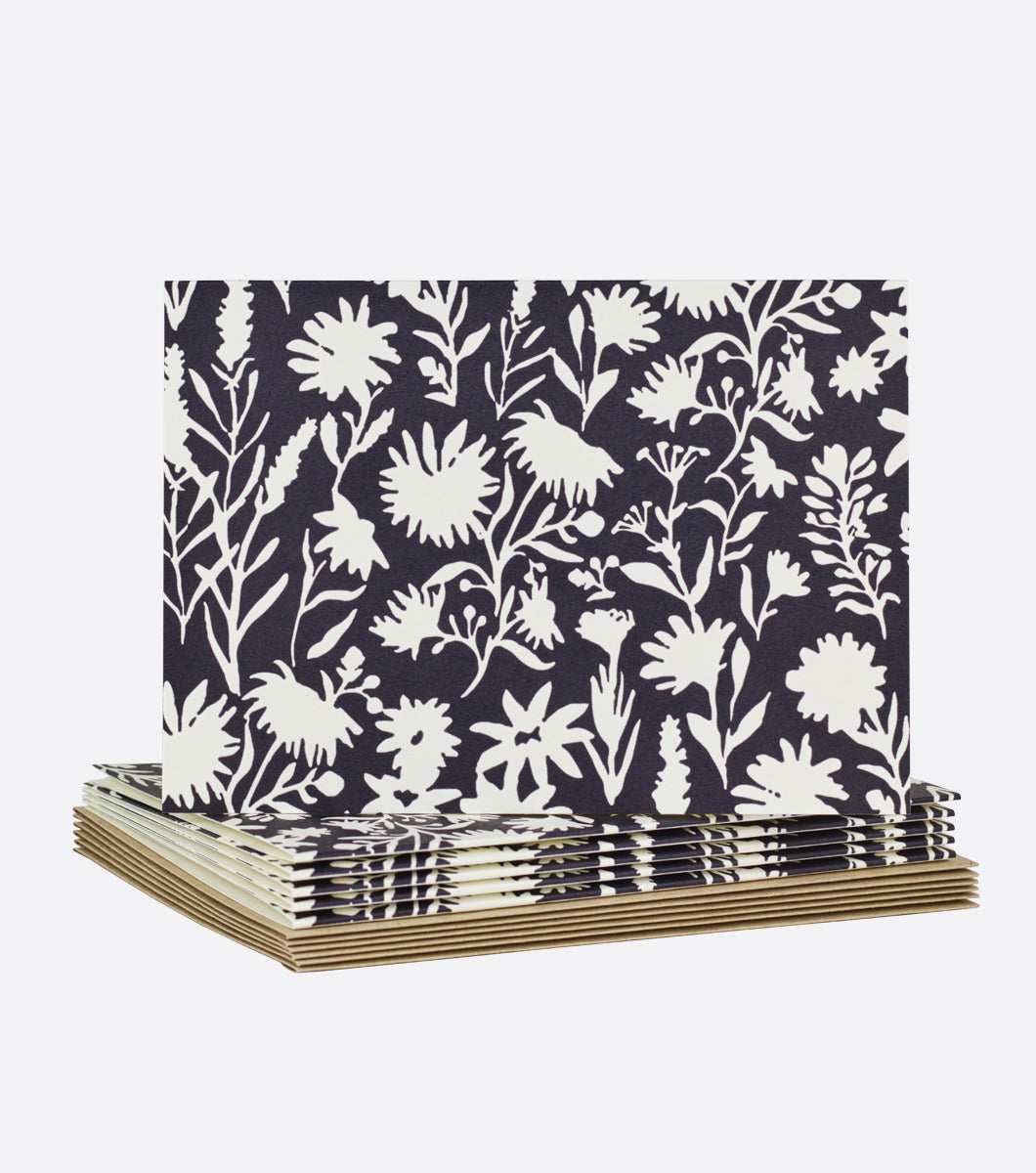 stack of wildflower story field limited boxed notes with one on top. card features black and cream floral design